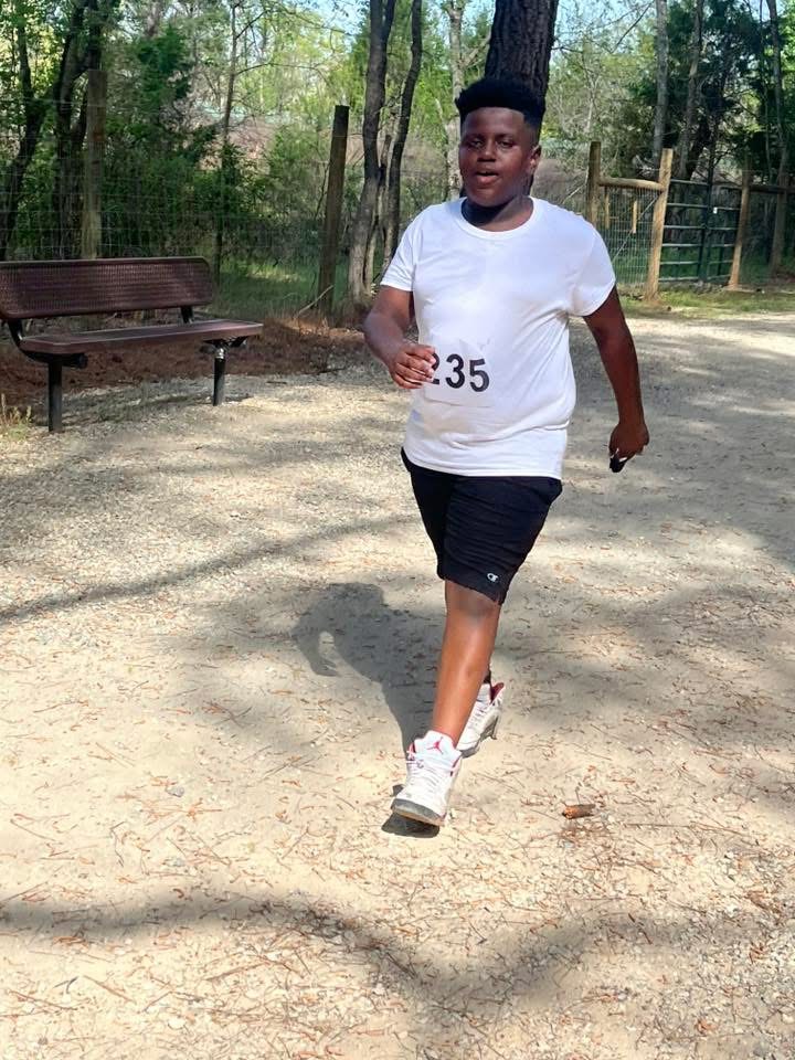 Josiah, youth runner Bib #235 at the 2025 Run to Empower Entrepreneurs 5K