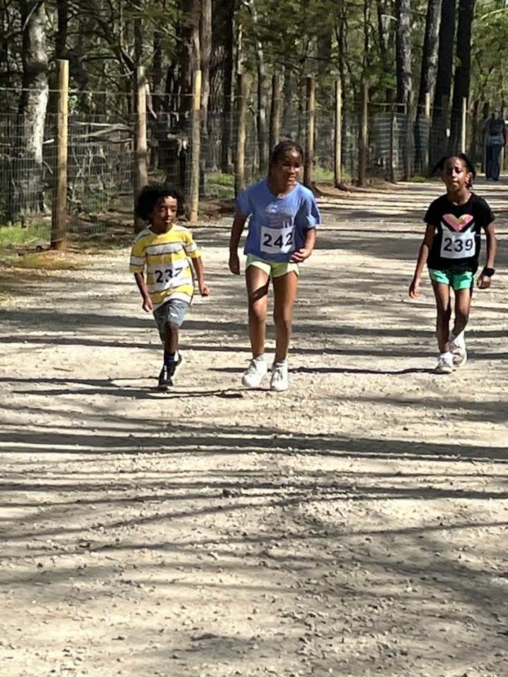 Youth runners on the course at the 2025 Run to Empower Entrepreneurs 5K